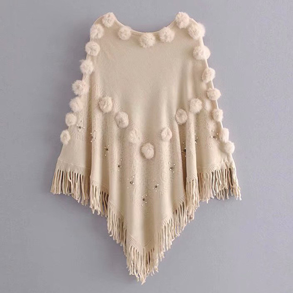 Női poncsó rojtokkal és pehelyszínnel, bézs színben
