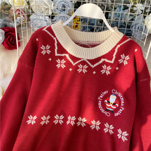 Modern női pulóver ovális nyakkivágással és karácsonyi mintával piros és bézs színben