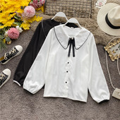 Modern női ing gombokkal és fekete-fehér szalaggal