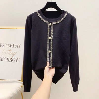 Modern női pulóver kerek nyakkivágással, fekete-fehér gyöngyökkel