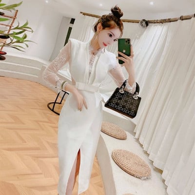 Elegáns női ruha mély V-nyakkal és tüll ujjakkal, fehér színben