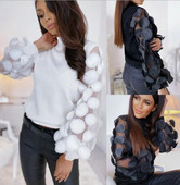 Modern női blúz magas gallérral és hosszú, széles ujjú fehér és fekete színben