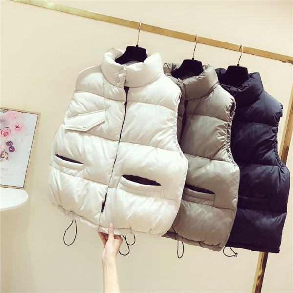 Női őszi-téli mellény zsebekkel és spitzgallérral fekete, bézs és barna színekben