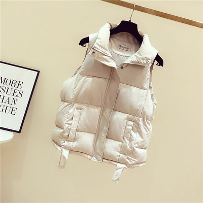 Női alkalmi mellény zsebekkel és spitz nyakkivágással fekete-fehér színben