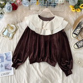 Női blúz barna és fekete színben, kerek nyakkivágással és hosszú ujjal