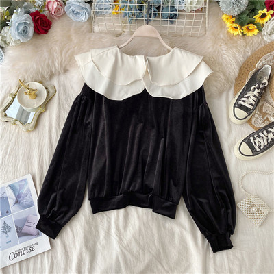 Női blúz barna és fekete színben, kerek nyakkivágással és hosszú ujjal