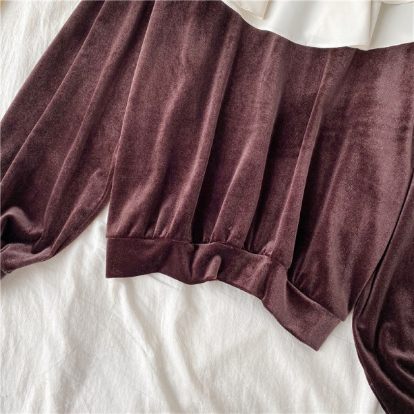 Női blúz barna és fekete színben, kerek nyakkivágással és hosszú ujjal