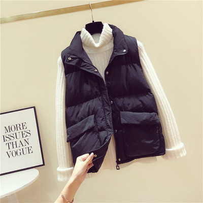 Női alkalmi mellény fehér és fekete zsebekkel