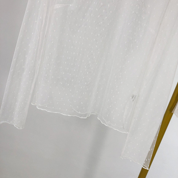 Bluză de damă modernă, transparentă, albă, cu mâneci lungi și decolteu rotund