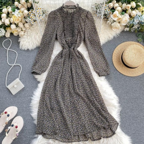 Új modell kivágott női ruha virágos motívumokkal és hosszú karral kék, sárga, fekete és bézs színben