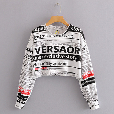 Modern rövid blúz, hosszú ujjú zöld, narancssárga és fehér feliratokkal