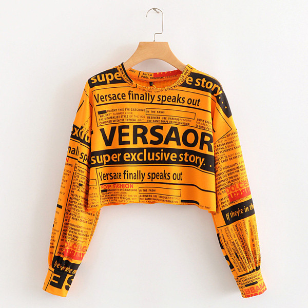 Modern rövid blúz, hosszú ujjú zöld, narancssárga és fehér feliratokkal