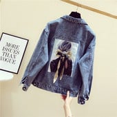 Női farmerdzseki színes rátéttel a hátán kék színben