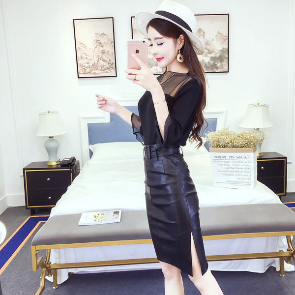 Női őszi-téli szoknya öko bőrből fekete színben, övvel és hasítékkal