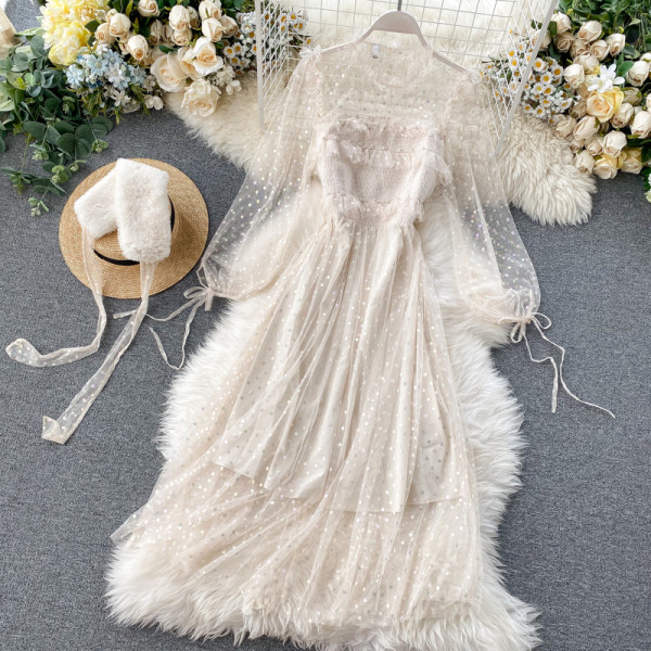 Μακρύ γυναικείο φόρεμα σε μπεζ και ροζ χρώμα με γούνα και κορδόνια