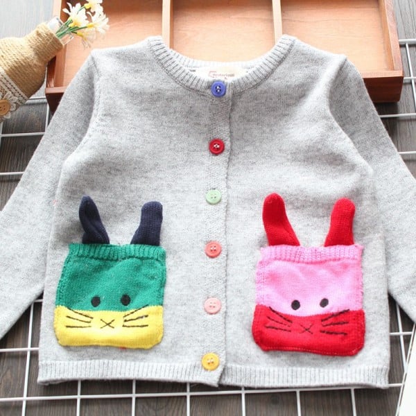 Modern gyerekmellény lányoknak, zsebekkel és színes szürke gombokkal