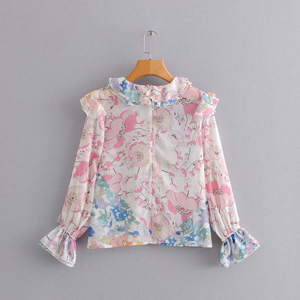 Női alkalmi blúz fürtökkel, fehér és virágmintával