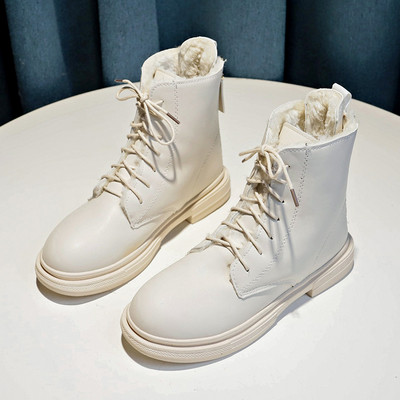 Női bőrcsizma cipzárral és lapos talppal, fekete-fehér színben