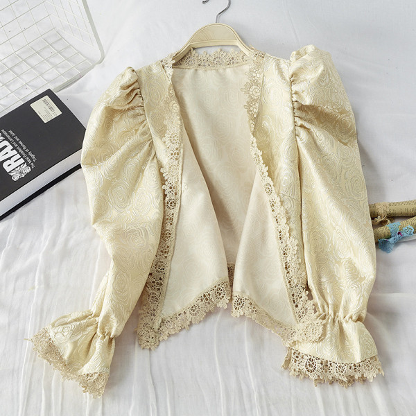 Modern női blúz spitz nyakkivágással és lótusz ujjú fekete és bézs színben