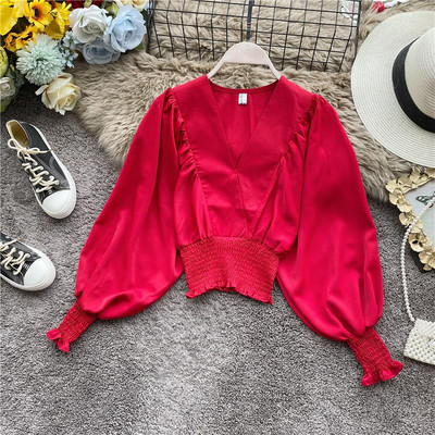 Modern női blúz spitz nyakkivágással és széles ujjakkal több színben