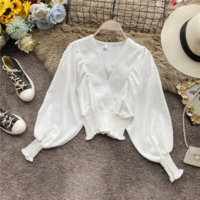 Modern női blúz spitz nyakkivágással és széles ujjakkal több színben