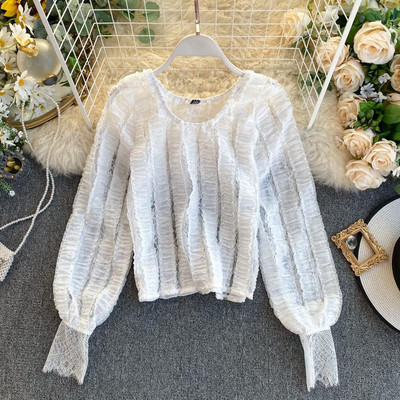 Modern női blúz ovális nyakkivágással és hosszú ujjú zöld, fehér és fekete színben