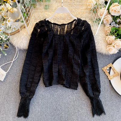 Modern női blúz ovális nyakkivágással és hosszú ujjú zöld, fehér és fekete színben