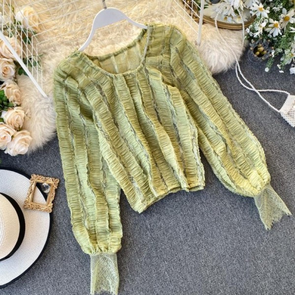 Modern női blúz ovális nyakkivágással és hosszú ujjú zöld, fehér és fekete színben