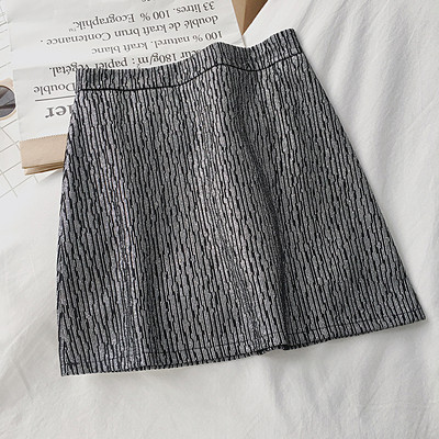 Női szoknya fehér, fekete és kék színben, magas derékkal és A-vonallal