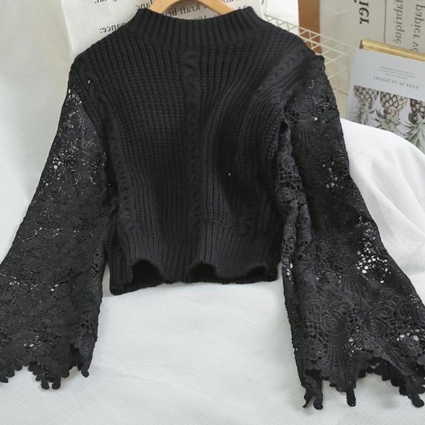 Modern női pulóver ovális nyakkivágással, fehér és fekete hímzéssel