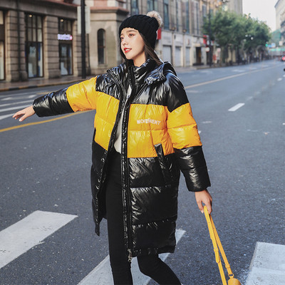 Modern női kabát hosszú modell kapucnival fekete, sárga és fehér színekben