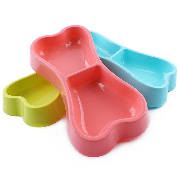 Dog bowl with two compartments for food and water in the shape of a bone in pink, blue and green