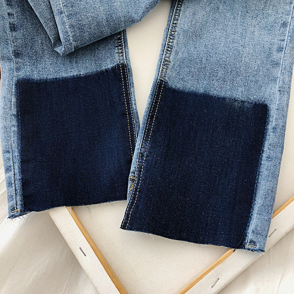 Modern női farmer kék színben, zsebekkel és magas derékkal