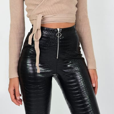 Modern women`s leather pants with high waist and zipper in black color
