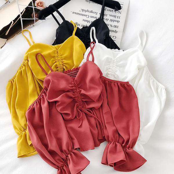 Modern női blúz pántokkal és hosszú ujjal