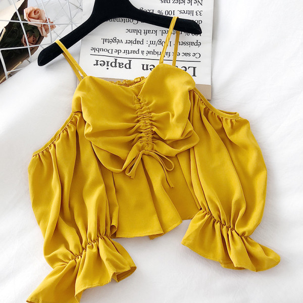 Modern női blúz pántokkal és hosszú ujjal