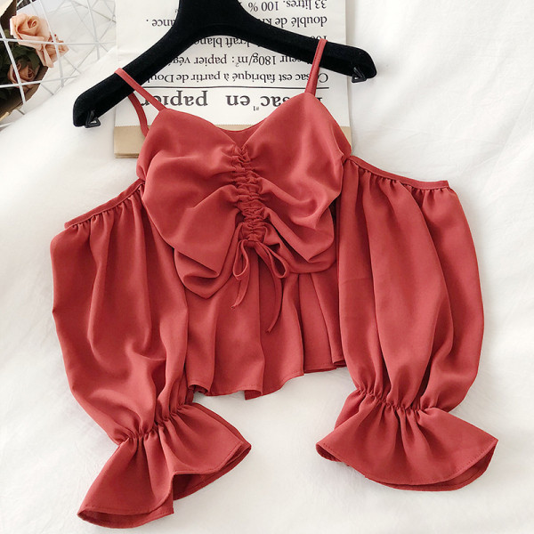 Modern női blúz pántokkal és hosszú ujjal