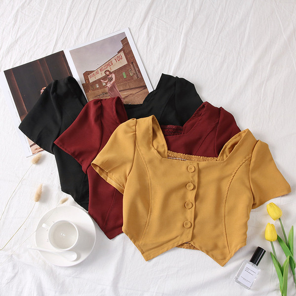 Moodne naiste topp kandilise dekoltee ja nööpidega