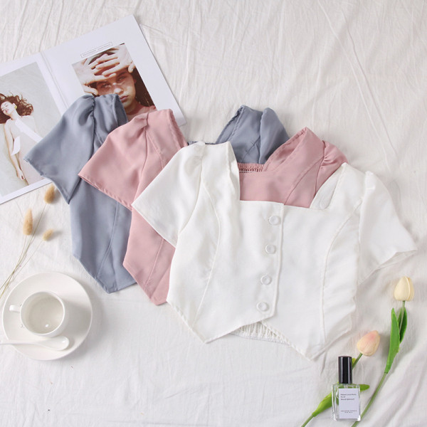 Moodne naiste topp kandilise dekoltee ja nööpidega