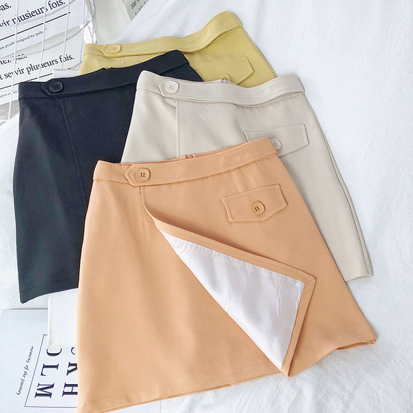 Női aszimmetrikus szoknya magas derékkal és gombokkal