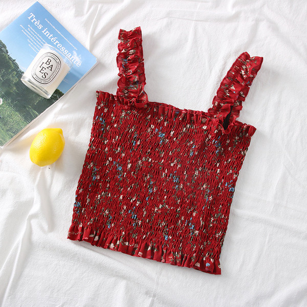 Új modell női felső pántokkal és virágmotívumokkal