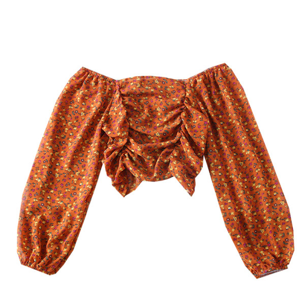 Modern női blúz csónakos nyakkivágással és virágmotívumokkal