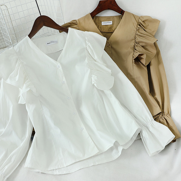 Új modell női ing fürtökkel és V-nyakkal