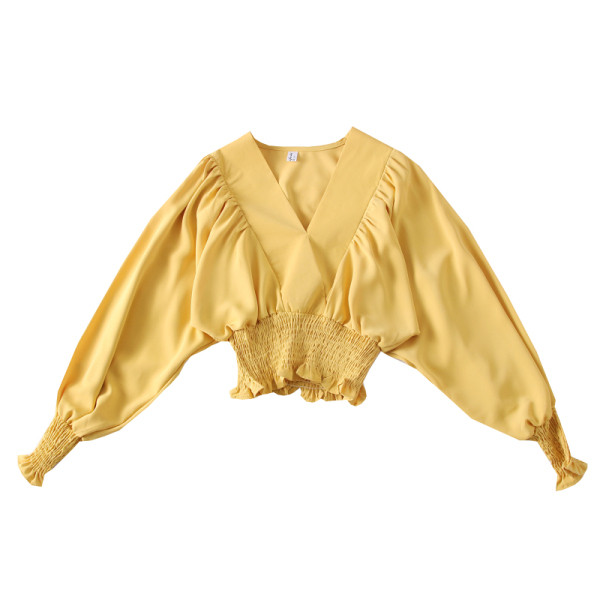 Modern női blúz széles ujjakkal és mély spitz nyakkivágással