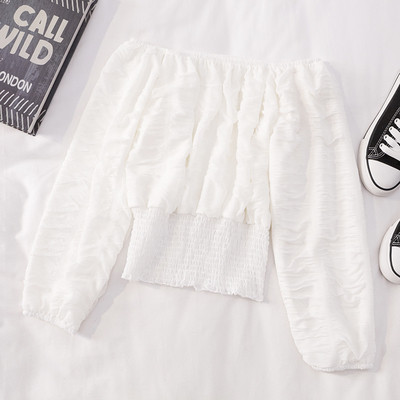 Modern női blúz hosszú ujjal és csónakos nyakkivágással