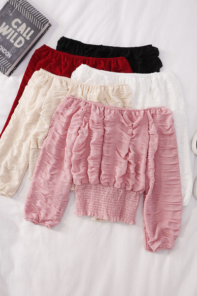 Modern női blúz hosszú ujjal és csónakos nyakkivágással