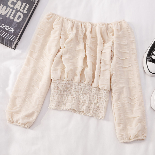 Modern női blúz hosszú ujjal és csónakos nyakkivágással