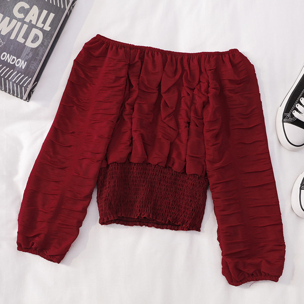 Modern női blúz hosszú ujjal és csónakos nyakkivágással