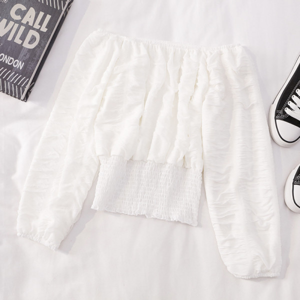 Modern női blúz hosszú ujjal és csónakos nyakkivágással