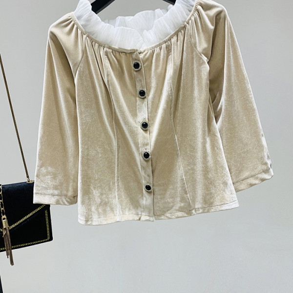 Modern női blúz ovális nyakkivágással és bársonygombokkal